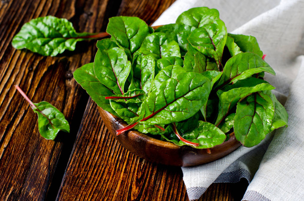 Fresh chard leaves in a wooden bowl - Photo, Image