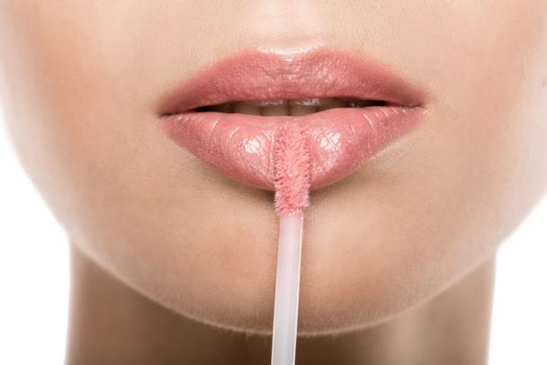 woman applying lipgloss - Фото, изображение
