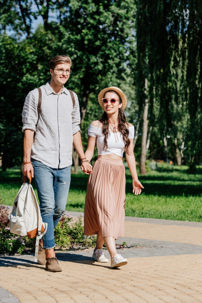 multicultural couple walking in park - Foto, Imagem