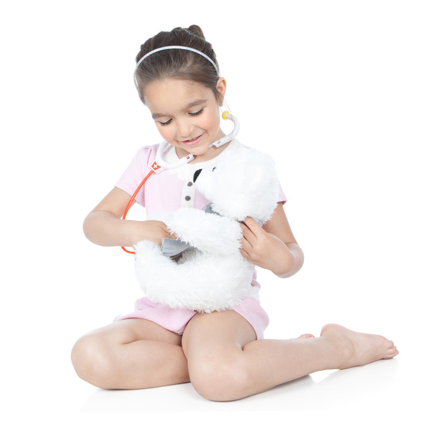 Little girl doctor with white teddy bear - Fotografie, Obrázek