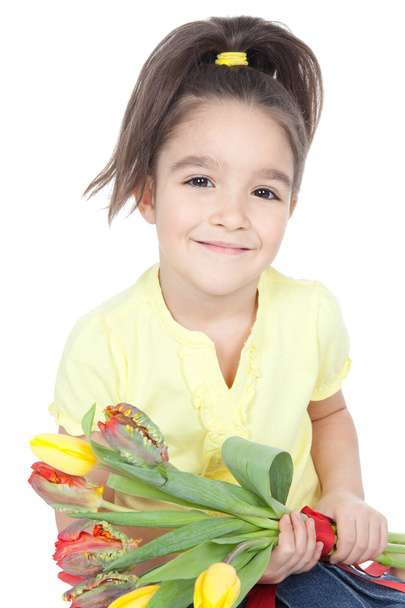 Beautiful little girl with a bouquet of tulips on white - Foto, Imagen