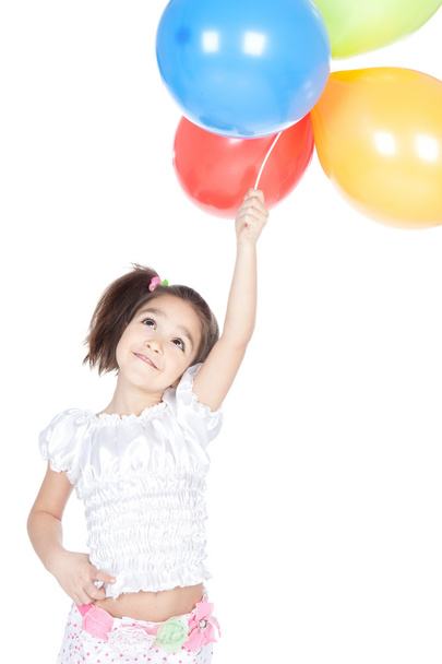 Little brunette girl with balloons in studio - Fotoğraf, Görsel