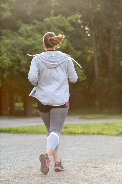 Overweight woman back running. Weight loss concept - Foto, imagen