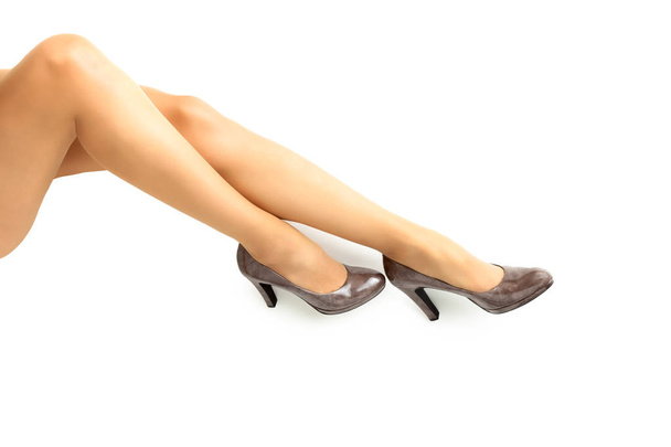 Long pretty woman legs on white background - Zdjęcie, obraz