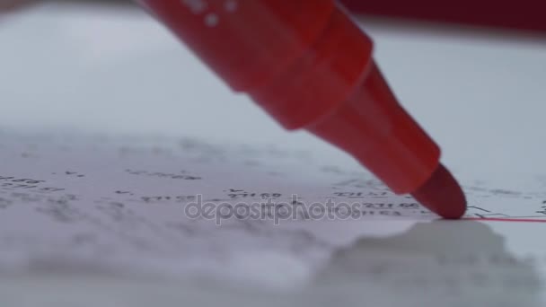 A red marker writes on a sheet of paper. Close-up. Marker Tip. Red marker with shadow - Footage, Video