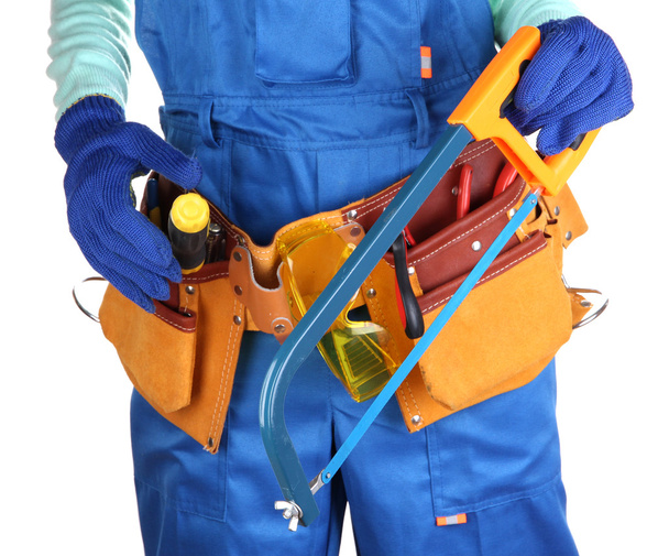 Male builder in blue overalls with saw isolated on white - Фото, зображення