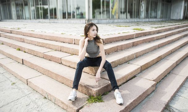 Asain cute woman sitting on steps  - Fotoğraf, Görsel