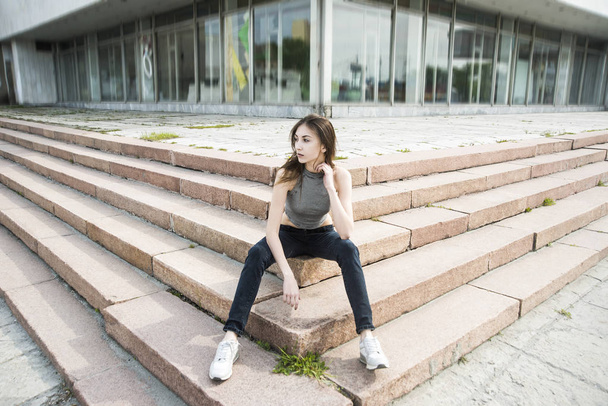 Asain cute woman sitting on steps  - 写真・画像