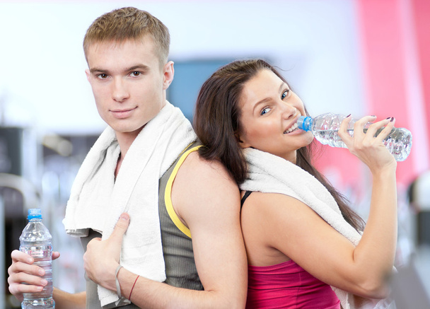 Man and woman drinking water after sports - Zdjęcie, obraz