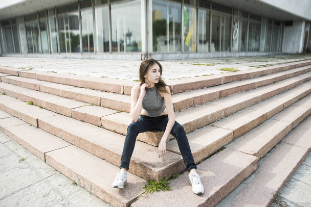 Asain cute woman sitting on steps  - Zdjęcie, obraz