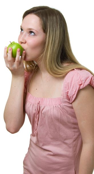 Girl eats a green apple - Zdjęcie, obraz