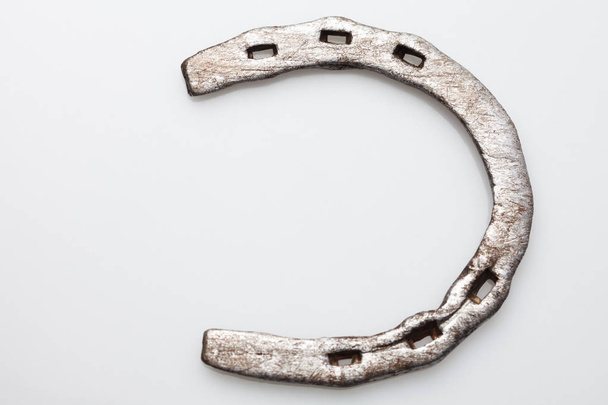 An old horseshoe on a white background - Foto, immagini