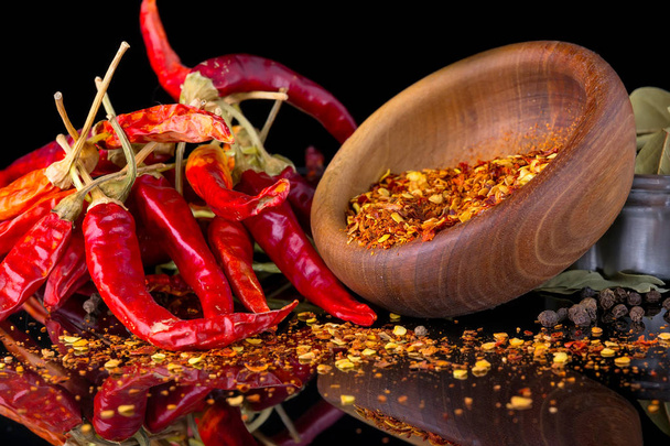 Chili peppers on a black background - Foto, Imagen