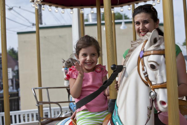 Mom and Daughter on merry-go-round - Photo, image