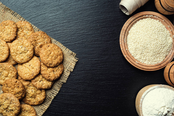 Biscuit sweet cookie background. Domestic stacked butter biscuit pattern concept,close up macro.Homemade cookies on wooden table.Cereal biscuits with the sesame,peanuts,sunflower and amaranth. - 写真・画像