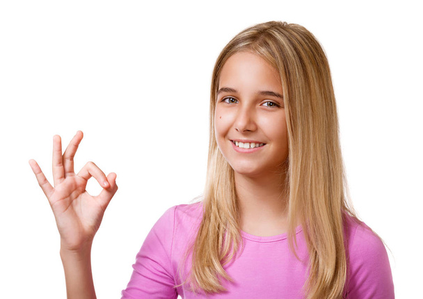 Picture of pretty young girl  showing ok sign.Isolated - Фото, изображение