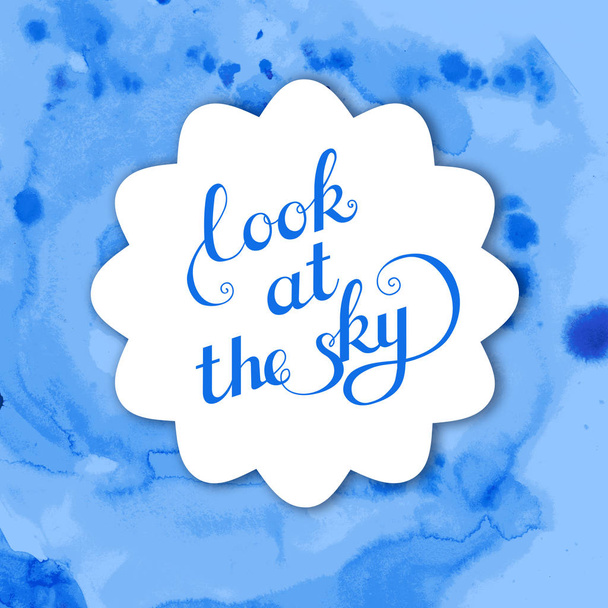 blue watercolor background with inscription Look at the sky - Фото, изображение