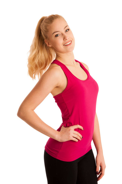 Fit blond woman isolated over white background. - Foto, Bild