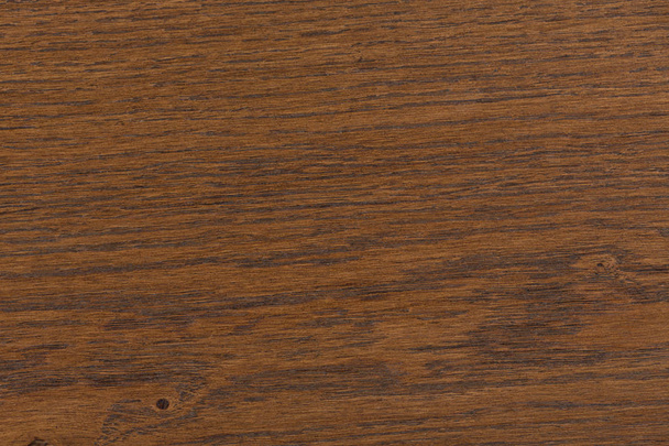Hintergrund einer dunklen Holztischoberfläche mit feiner Struktur. - Foto, Bild