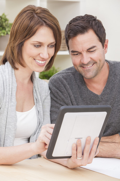 Happy Man & Woman Couple Using Tablet Computer at Home - 写真・画像
