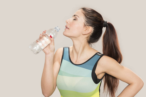 Sports Woman with a bottle of water - Photo, image