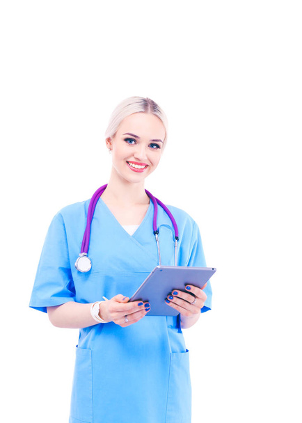 Female doctor using a digital tablet and standing on white background. Woman doctors. - Foto, Imagen