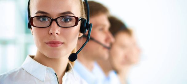Attractive positive young businesspeople and colleagues in a call center office - Photo, image