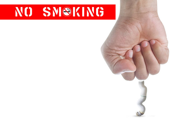 Man's fist crushing cigarette - Φωτογραφία, εικόνα