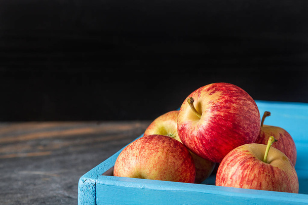 Apples from the village. Harvesting. Dark background. - Фото, изображение