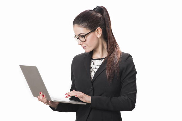 Young successful career woman holds her laptop  - Zdjęcie, obraz