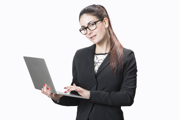 Young successful career woman holds her laptop  - Photo, Image