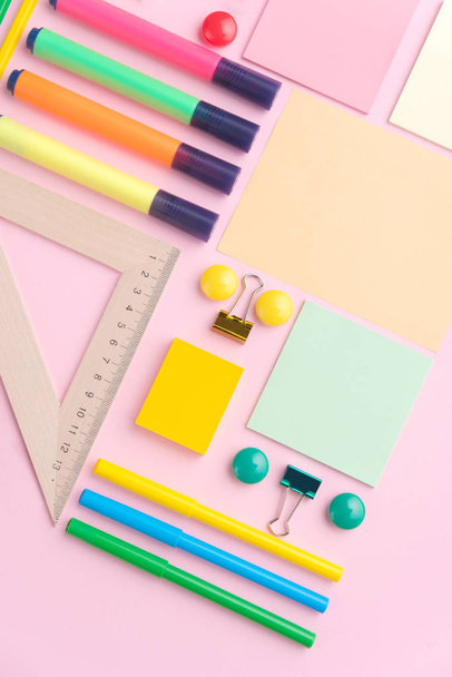 Office supplies on the pink background table - Photo, image