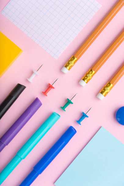 Office supplies on the pink background table - Photo, image
