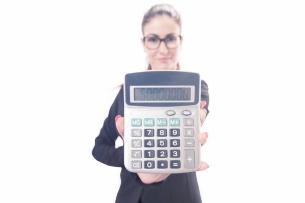 Isolated young business woman showing calculator - Foto, imagen
