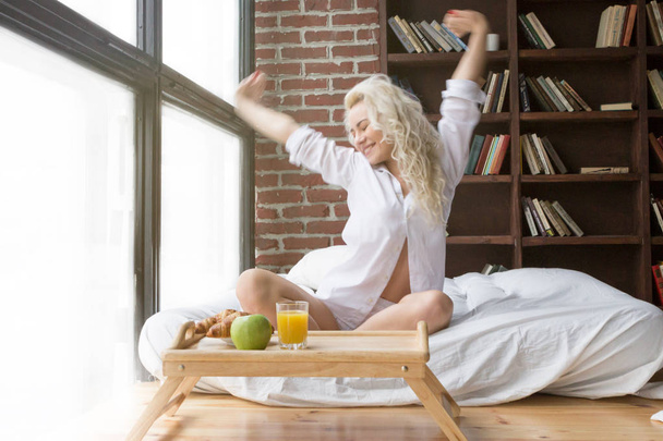 Beautiful Woman Stretching in Bed - Fotoğraf, Görsel