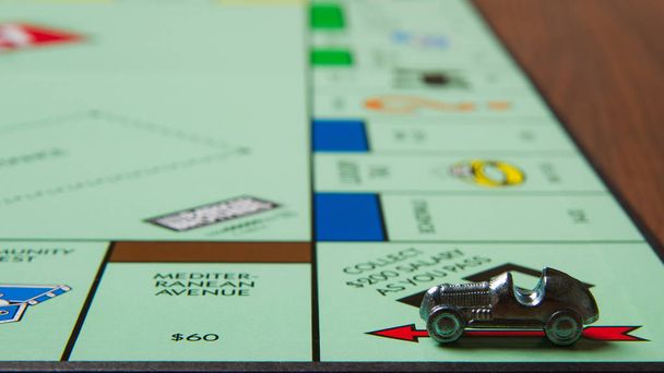 CALDWELL, IDAHO/USA - MARCH 16, 2015: Car collected 200 bucks passing go in the game Monopoly - Photo, Image