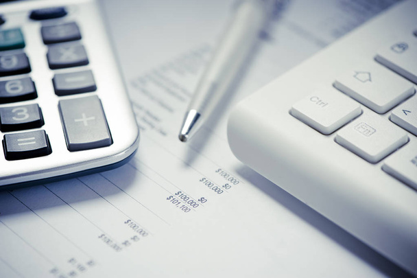 Calculator on financial and business documents - Фото, зображення
