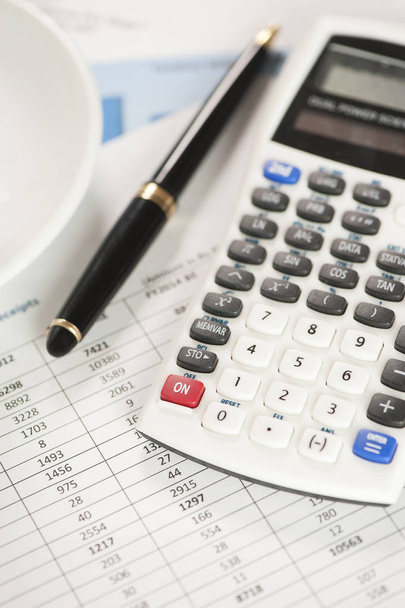 Calculator on financial and business documents - Zdjęcie, obraz