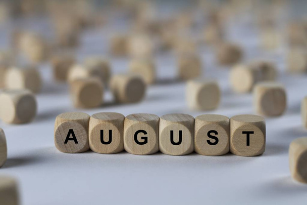 august   cube with letters, sign with wooden cubes - Photo, Image