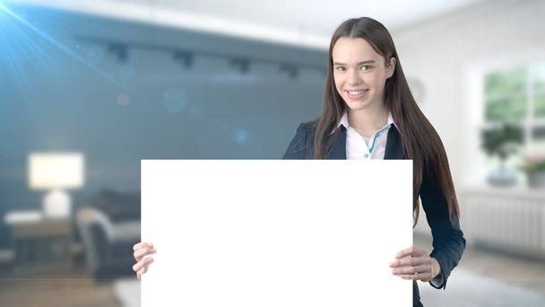 Young beautiful business woman and creative designer standing over blured interior background - Foto, Imagem