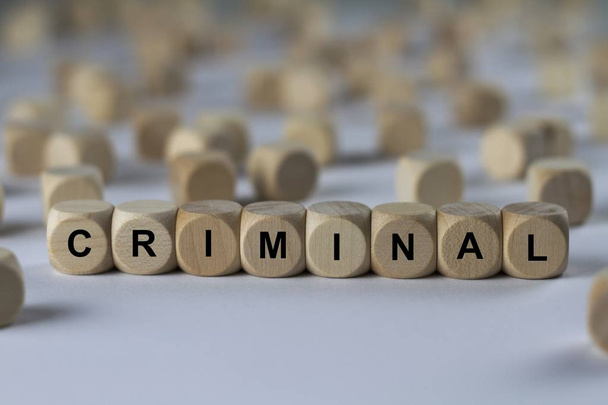 criminal   cube with letters, sign with wooden cubes - Fotoğraf, Görsel