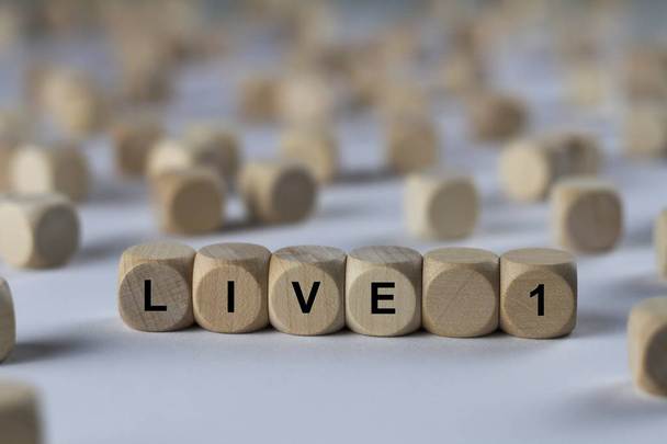 live 1   cube with letters, sign with wooden cubes - Photo, Image