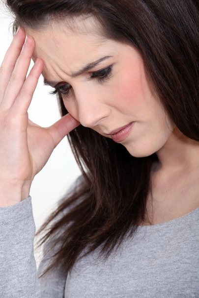 Close-up picture of young woman having migraine - Foto, afbeelding