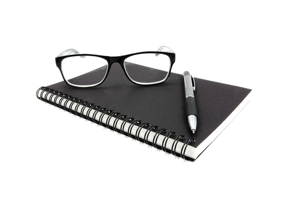 Notebook glasses and pen on white background. - Fotografie, Obrázek