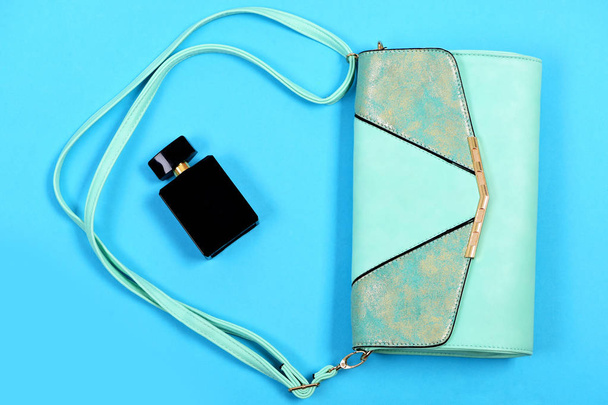 Fashion and glamour concept. Purse in light turquoise color - Foto, imagen
