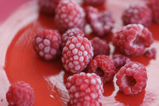Frozen berry raspberry with white hoarfrost - Фото, изображение