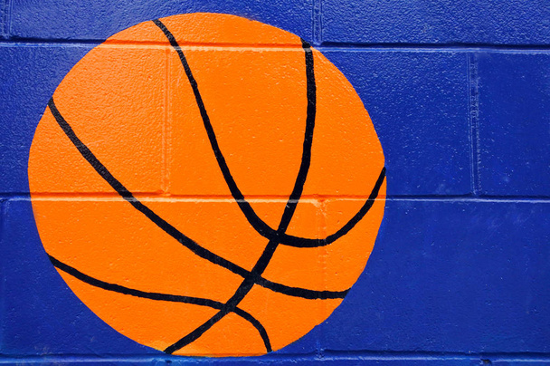 Basketball ball paint on blue wall  - Photo, Image