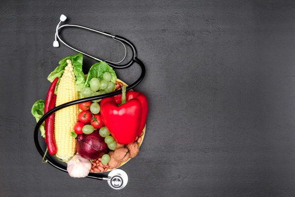 stethoscope, organic vegetables and fruits - Photo, Image