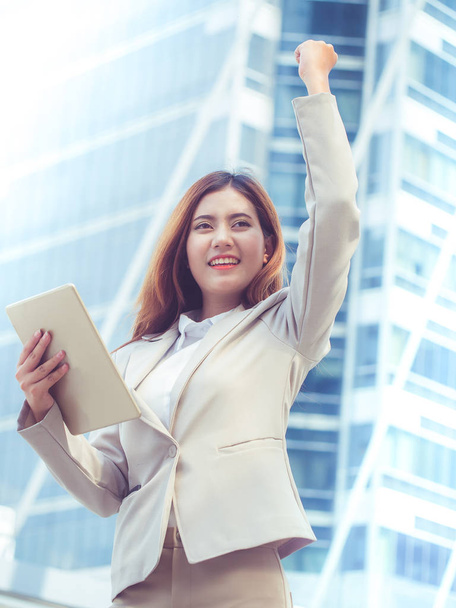 Successful business woman with arms up. - Photo, Image
