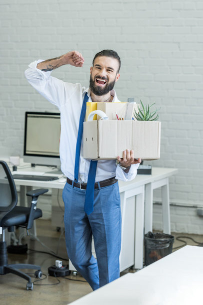 excited fired businessman with box - Фото, зображення